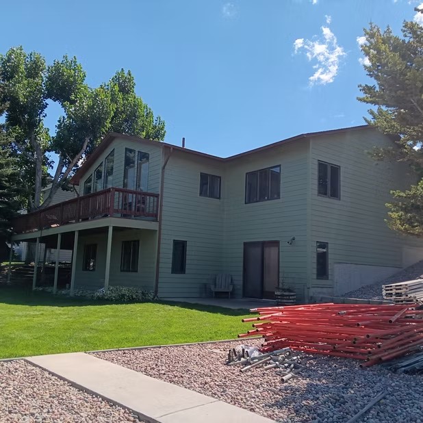 Two-story home and green lawn