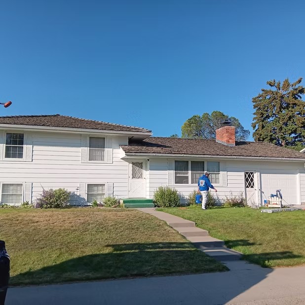 White home viewed from across the lawn