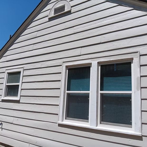 Freshly painted gable and window trim